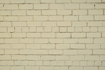 Fototapeta premium Cegła pomalowana na żółtym tle ściany