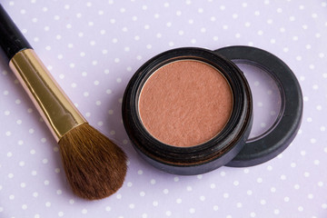 Powder Make Up Foundation Close Up With Detail and brush on a purple background, soft color bedding, decorative cosmetics on light background colorful, Pink Blush