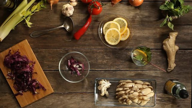red cabbage, tomatoes, garlic and onions on old wooden table