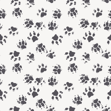 Vector seamless pattern with paw footprints of a dog