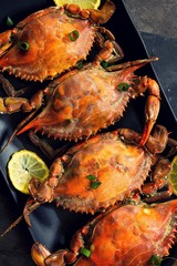 Steamed Blue crabs with lemon garnish