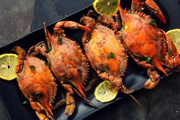 Image of Steamed Blue crabs with lemon garnish printed on Printed Glass Splashbacks