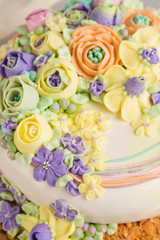 Fototapeta na wymiar Closeup butter cream flowers decoration on cake