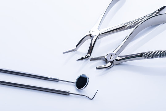Basic dental tools on white table
