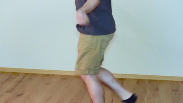 Man Jumping on Skipping Rope in T-Shirt Indoor