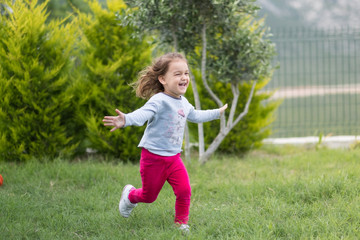 runnign child in garden
