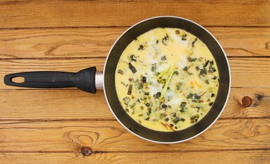 Omelet with spinach cooked in olive oil