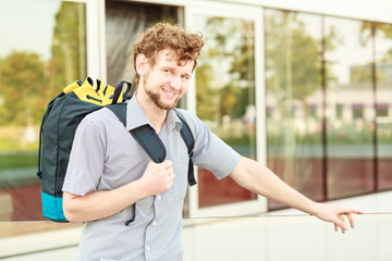 Fototapeta premium Man tourist backpacker having fun in city