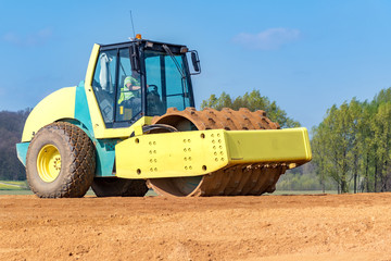 Fototapeta premium Compactor working on the construction site