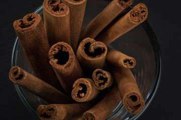 Top View of Cinnamon Sticks Standing in Glass Cup