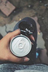 Selfie of hand and cola can with sunglass