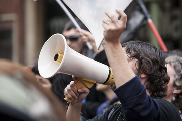 demostrator with megaphone and notebook protesting - obrazy, fototapety, plakaty