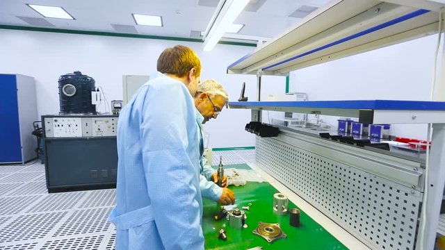 Two Engineers Were Collected and Tested Parts of the Device Tech Laboratory Testing Devices Instruments Close up