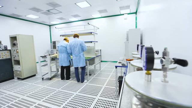 Two Engineers Were Collected and Tested Parts of the Device Tech Laboratory Testing Devices Instruments Close up Mid Shot