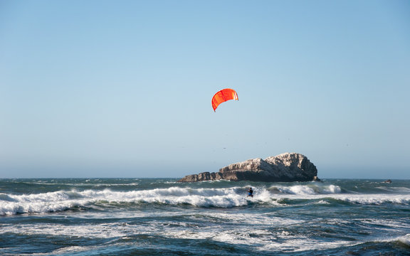 Matanzas, Chile - January 16, 2016 : Unidentified kitesurfer riding on the waves in Pacific ocean, documentary editorial.