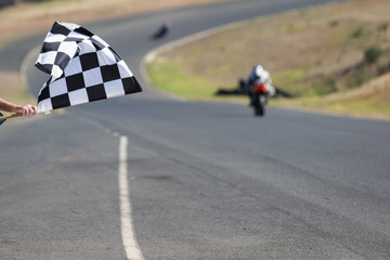 Checkered flag at a motorcycle race track