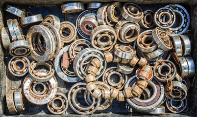 Pile of Old Rusty Ball Bearing Wheels