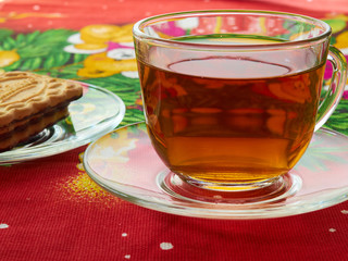 Fototapety  Filiżanka z herbatą i ciastkami