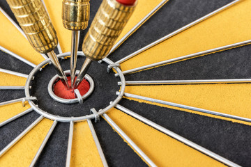 Closeup three dart target on bullseye