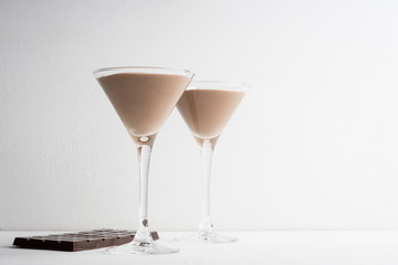 Chocolate mousse in martini glass on the wooden background