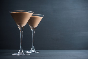 Chocolate mousse in martini glass on the wooden background