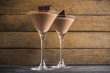 Chocolate mousse in martini glass on the wooden background