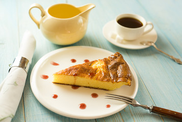 A piece of cottage cheese cake on a white plate