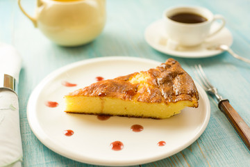 A piece of cottage cheese cake on a white plate