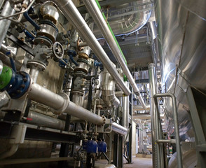 Equipment, cables and piping as found inside of a modern industr