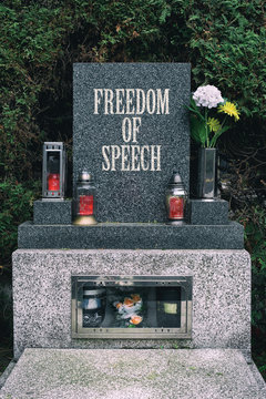 Gravestone with text Freedom of Speech as metaphor of rising censorship, political correctness and oppressive restrictions against freedom of expression and discussion.