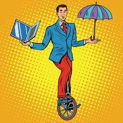 Businessman on unicycle business balance © studiostoks