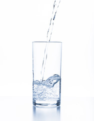 water splashing from glass isolated on white background