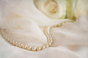 Wedding background with pearl beads and roses