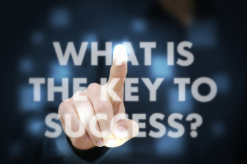 Businessman touching What Is The Key To Success?