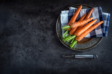 Carrot. Fresh Carrots bunch. Baby carrots. Raw fresh organic orange carrots. Healthy vegan vegetable food.