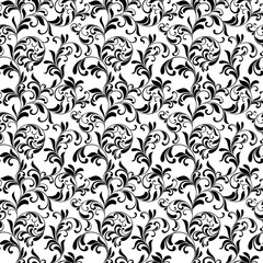 Fototapeta premium Elegant seamless pattern. Tracery of swirls and leaves on a white background. Vintage style