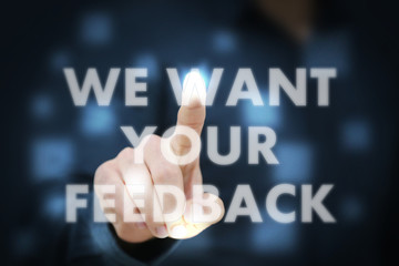 Businessman touching We Want Your Feedback