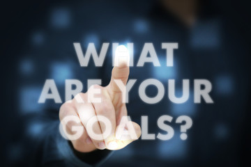 Businessman touching What Are Your Goals?
