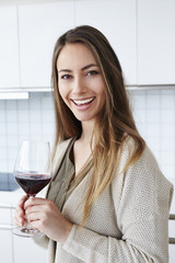 Portrait of beautiful woman holding wine glass