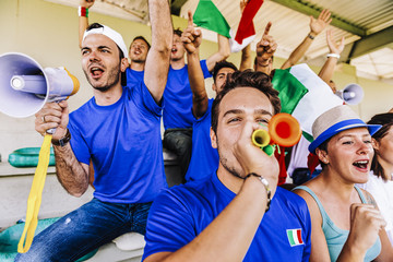 Supporters from Italy at stadium watching the match