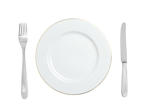 White plate, fork and knife isolated on white background