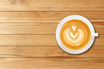 Cup of coffee latte art on wood background.Copy space