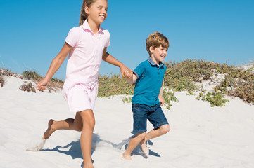 Children running on beach