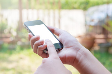 Female hand holding phone blur background with clipping path ins