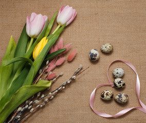 Easter postcard. Easter eggs and flowers on the table