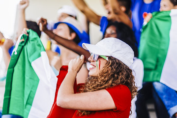 Obraz premium Supporters from Italy at stadium watching the match