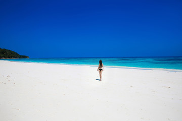 Enjoyment. Seashore. Happy free woman on tropical beach, exotic