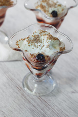 Delicious vanilla parfait with cherry jam and chocolate