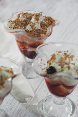 Delicious vanilla parfait with cherry jam and chocolate