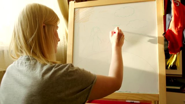 Woman Drawing Happy Family on Marker Board